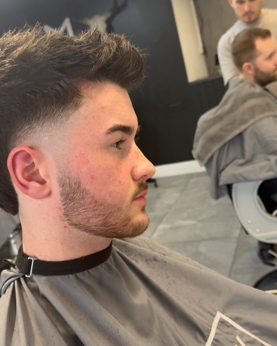 Textured cut with a skin fade and beard