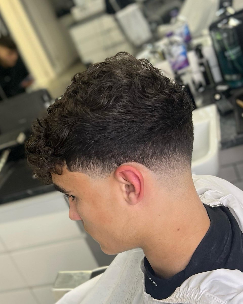 Curly crop with a low fade